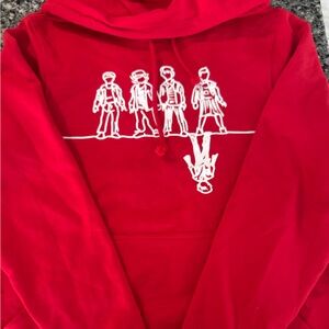 Vibrant Red Hoodie with Stranger Things Character Graphic Print